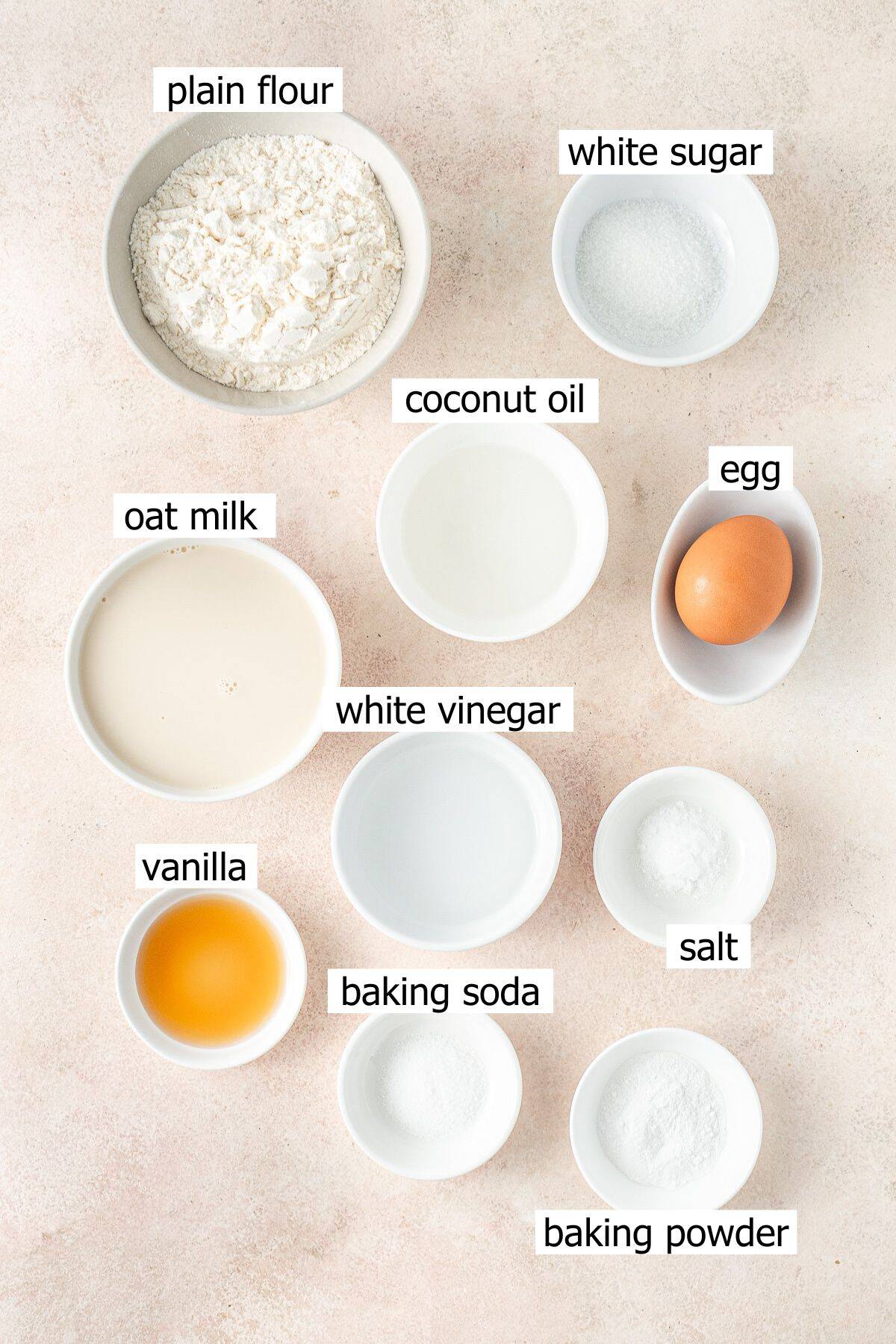 All ingredients needed to make dairy free pancakes laid out in bowls.