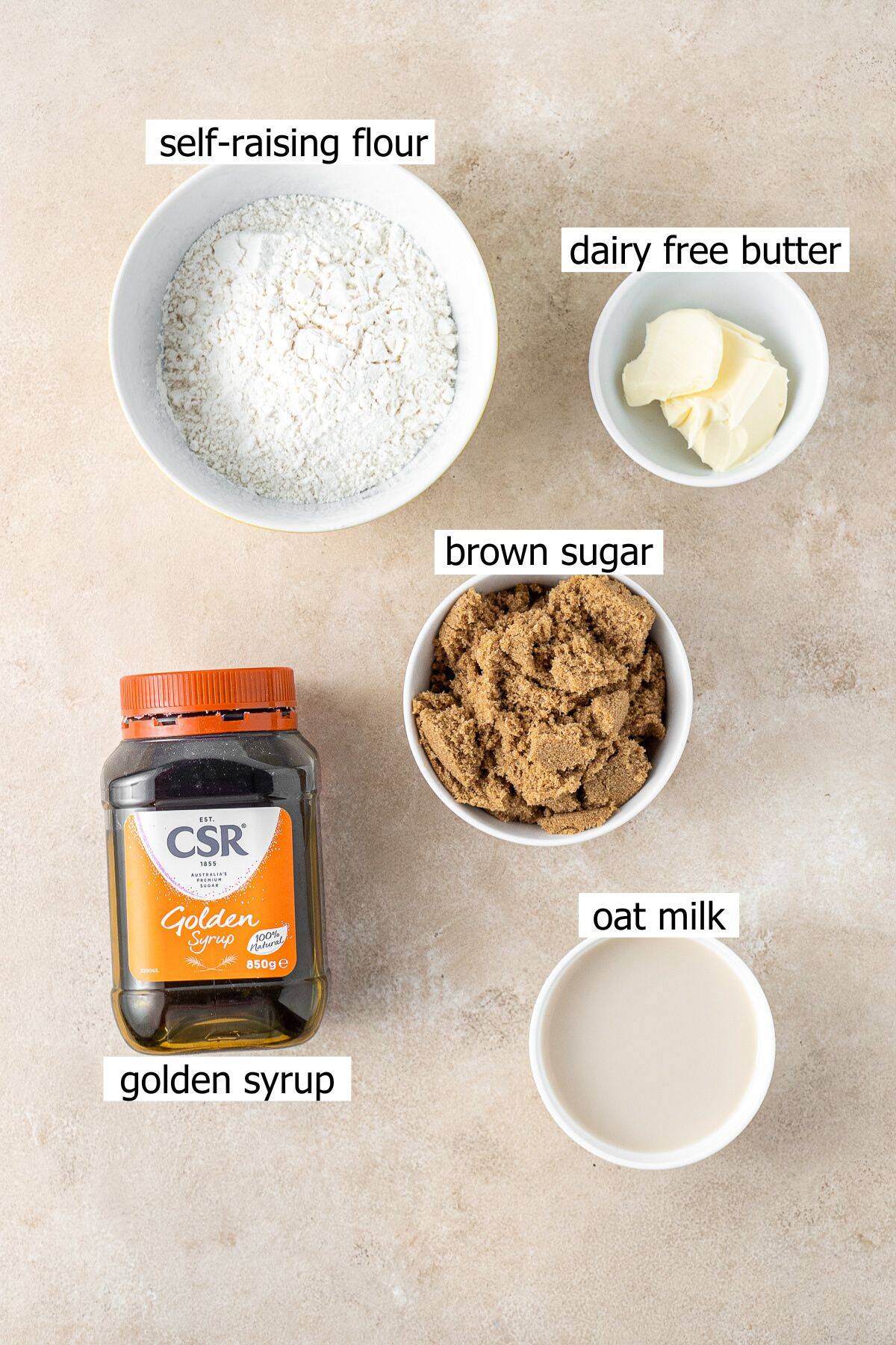 All ingredients needed to make this golden syrup dumplings recipe laid out in bowls.