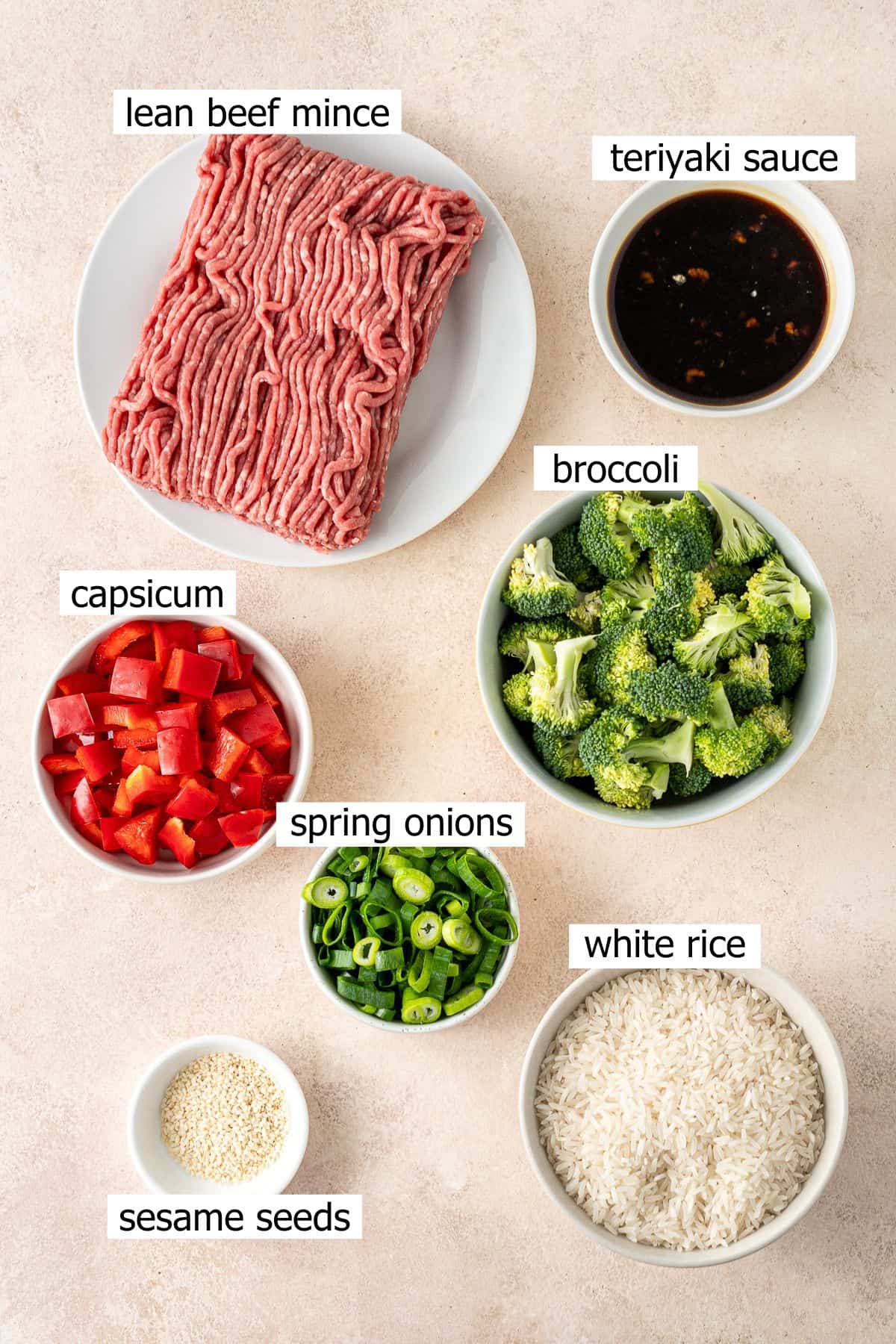 All ingredients to make a teriyaki beef bowl laid out in small bowls.