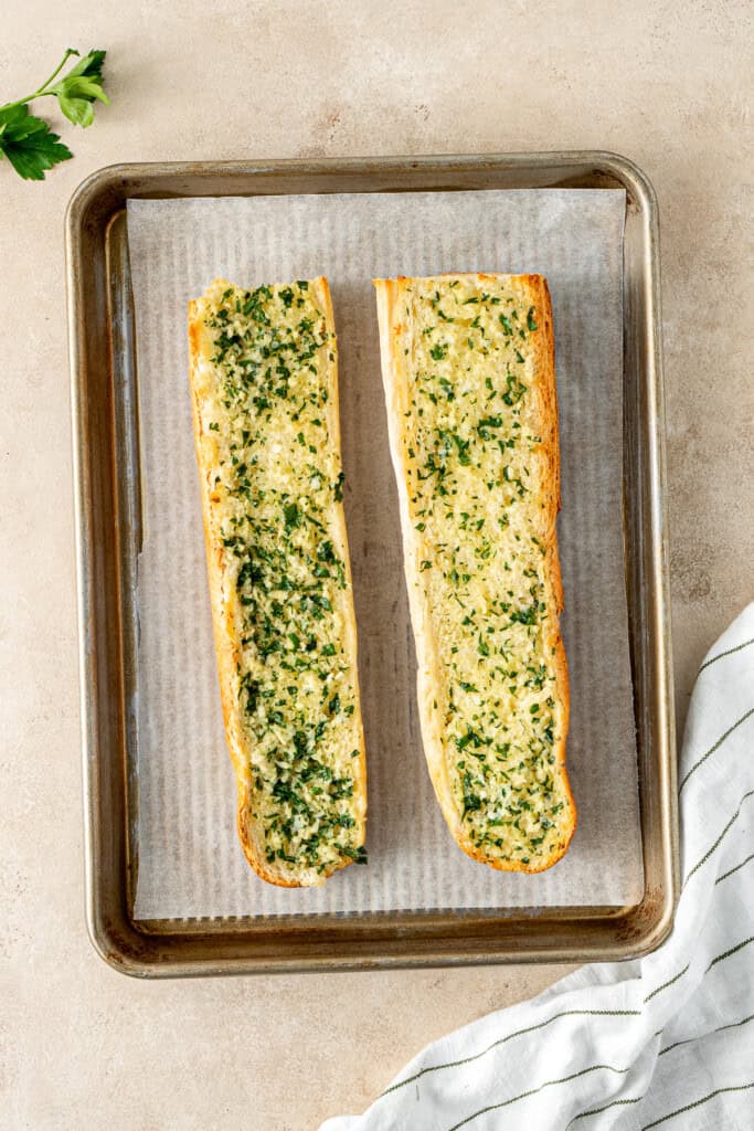 The cooked garlic bread on a tray.
