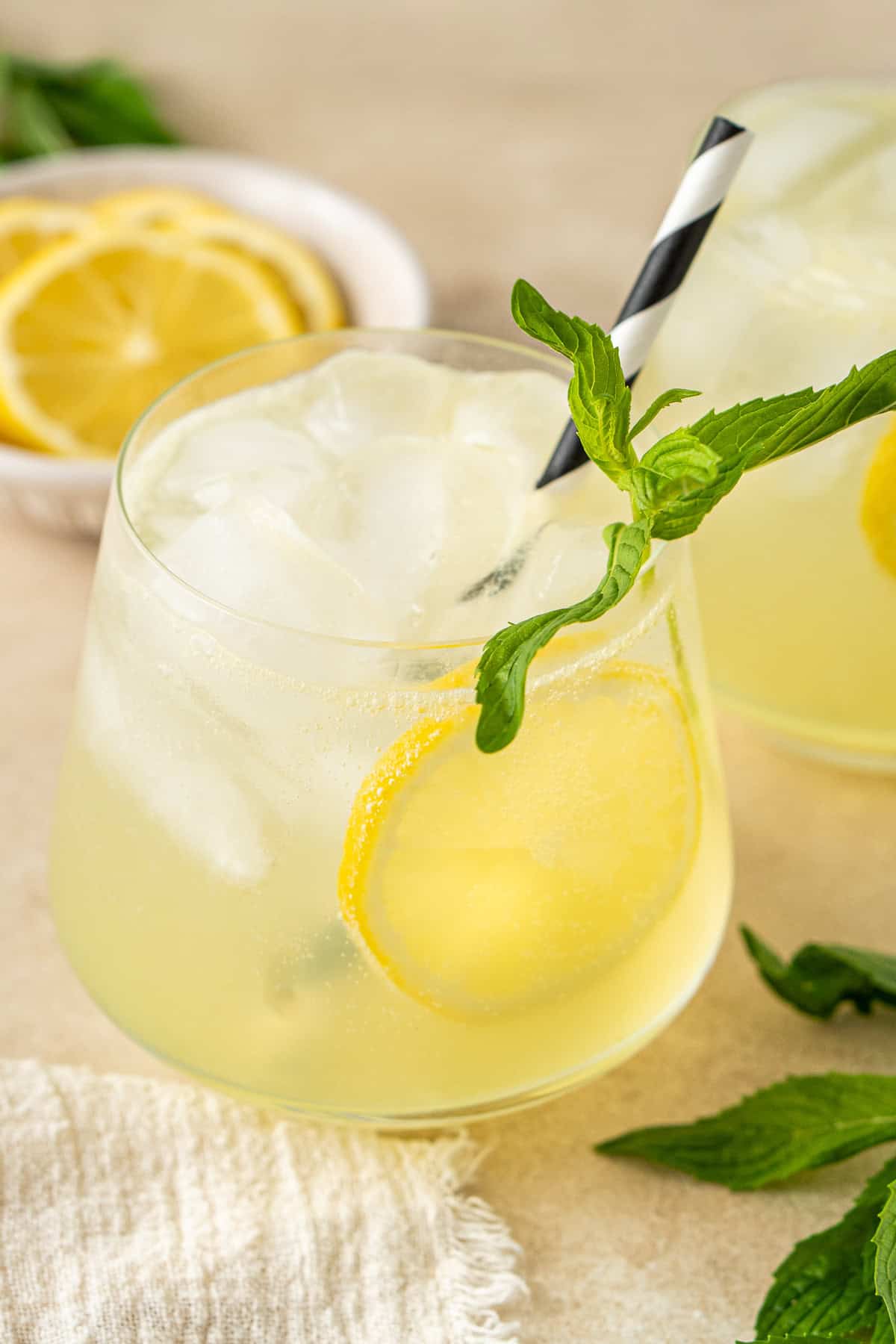 A lemon spritz mocktail with mint.