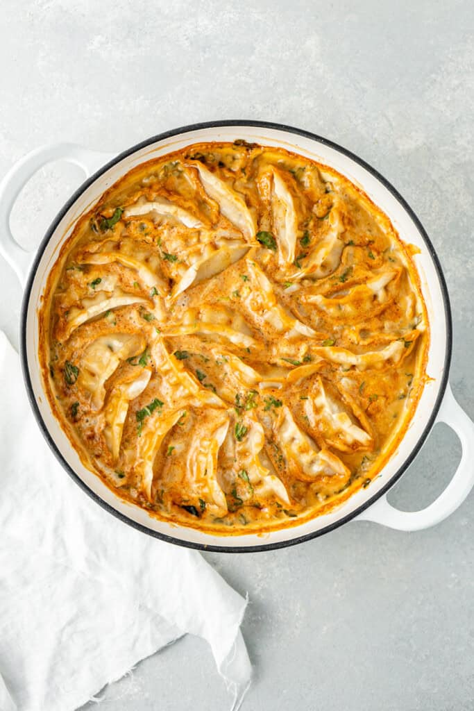 The baked dumplings in the casserole dish.