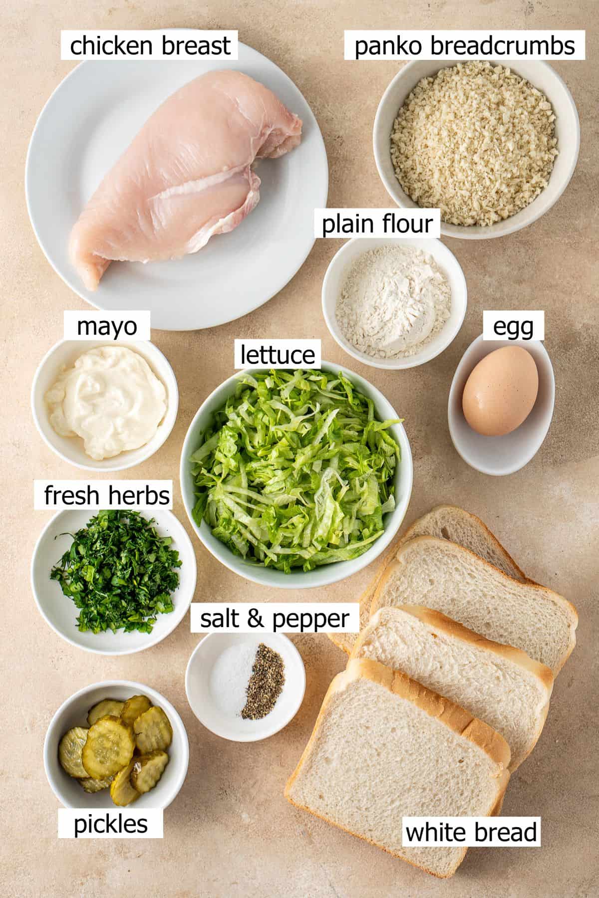 All ingredients needed to make a chicken schnitzel sandwich.