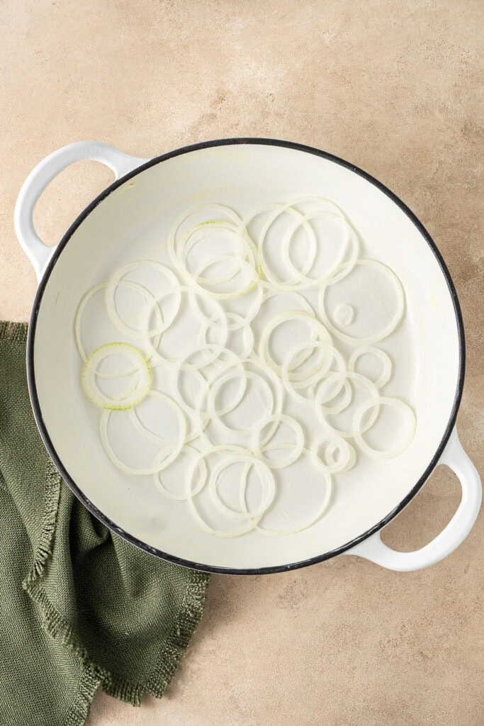Layering the onions in the pan.