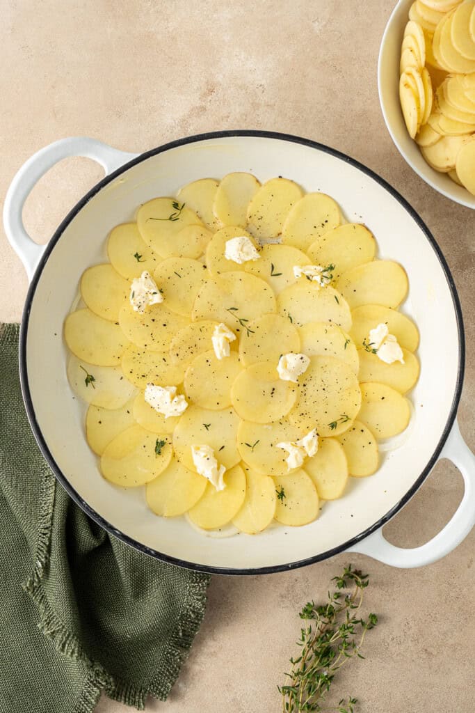 Layering in the potatoes.