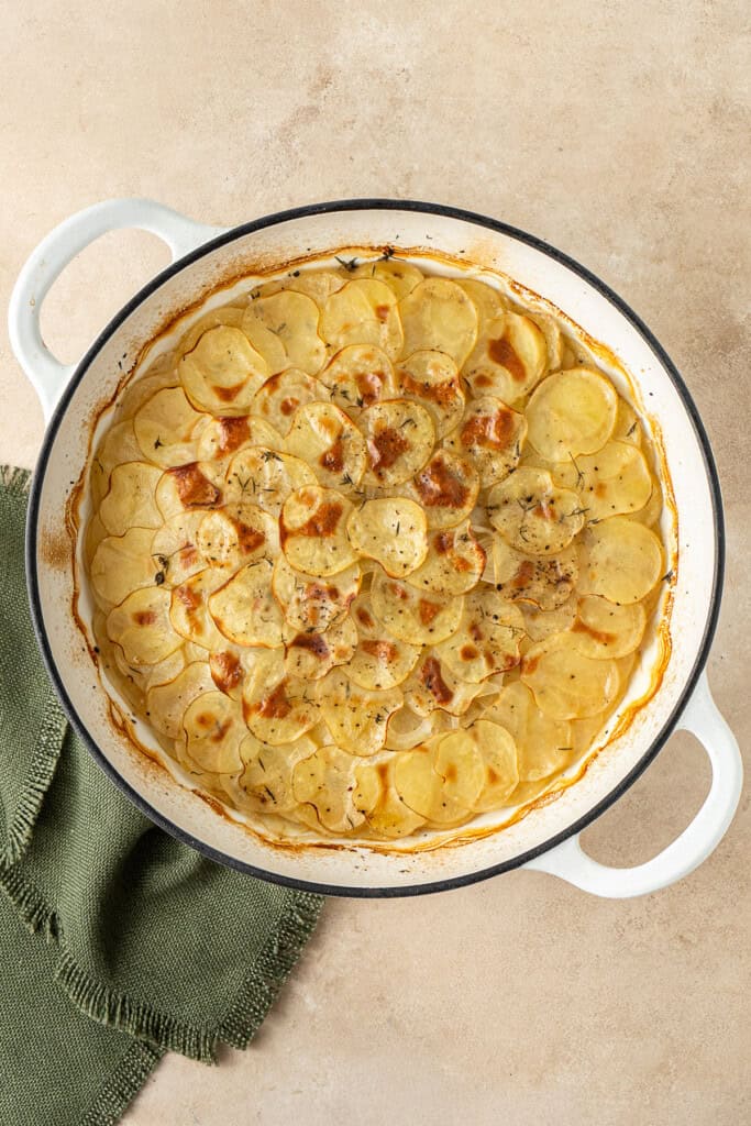 The boulangère potatoes cooked and golden brown.
