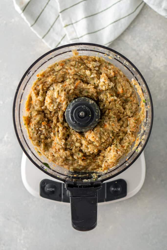 The chicken filling in a food processor.