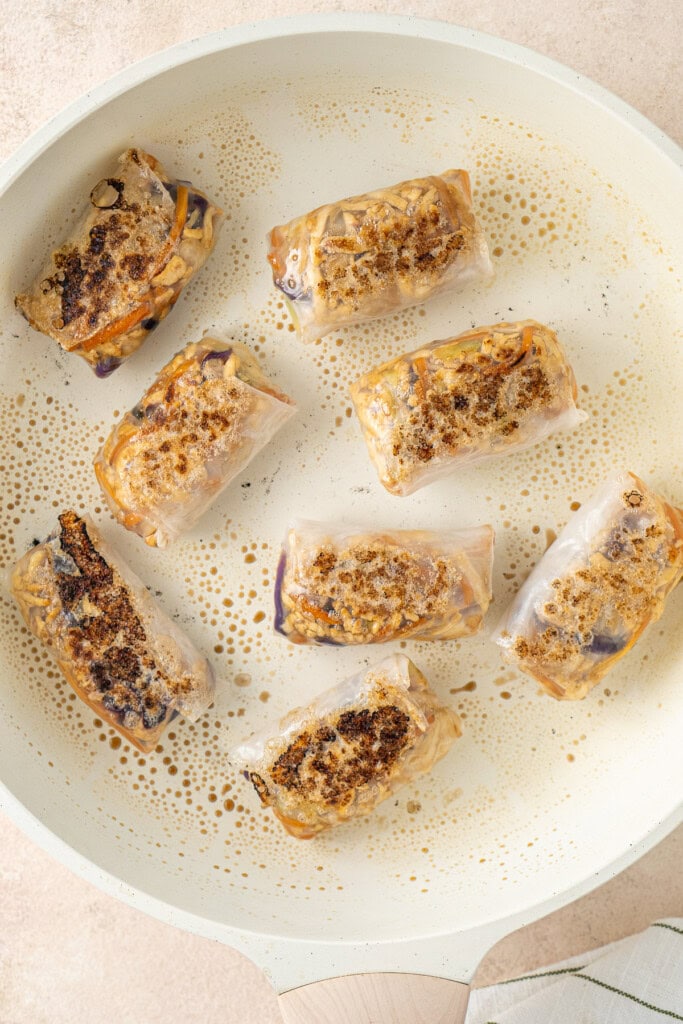 Cooking the dumplings in a frying pan.