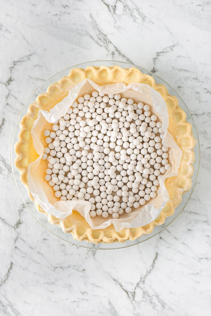 The pie weights in the pie dish.