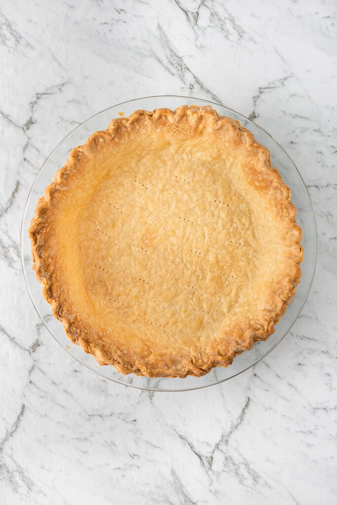The blind baked pie crust.