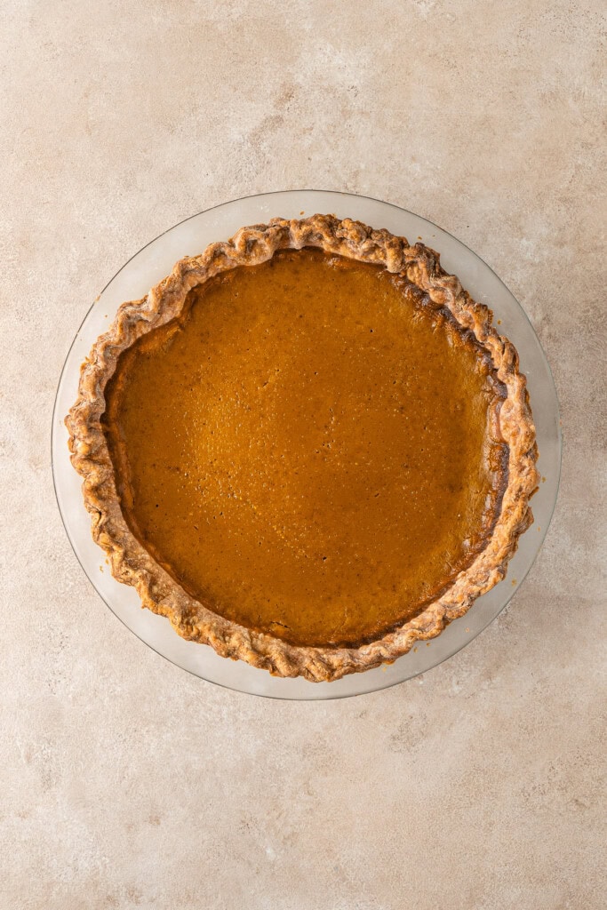 The cooked pumpkin pie in the dish.