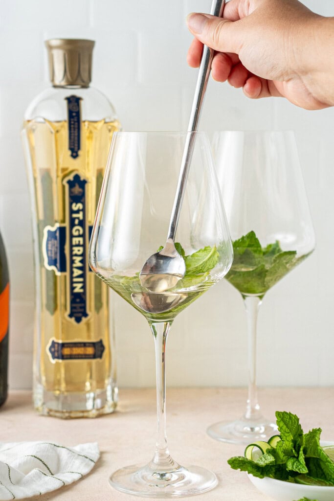 Muddling the mint with the St Germain. 