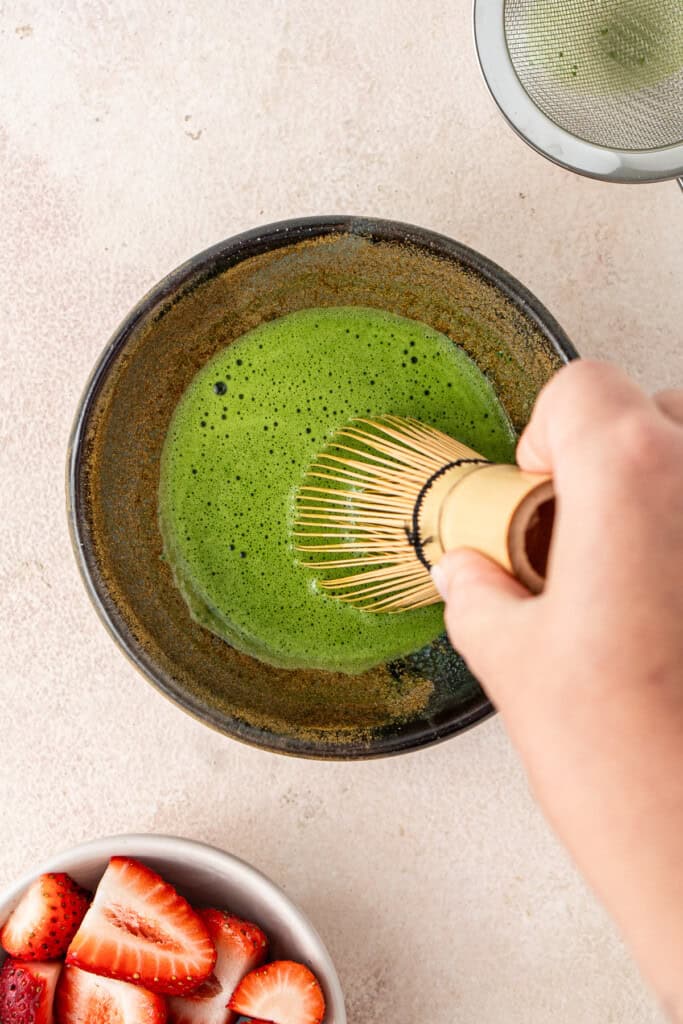 Whisking the matcha.