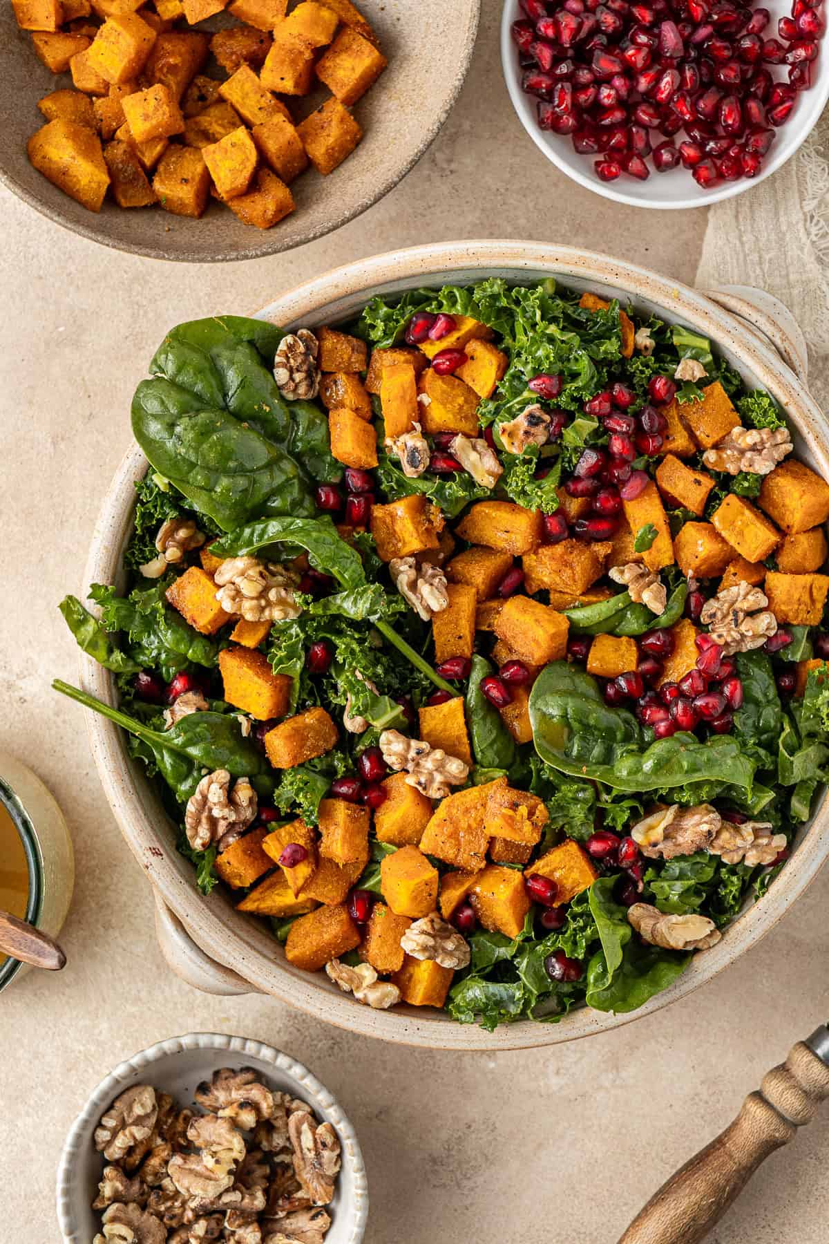 Roasted pumpkin salad served up with pomegranate and walnuts.