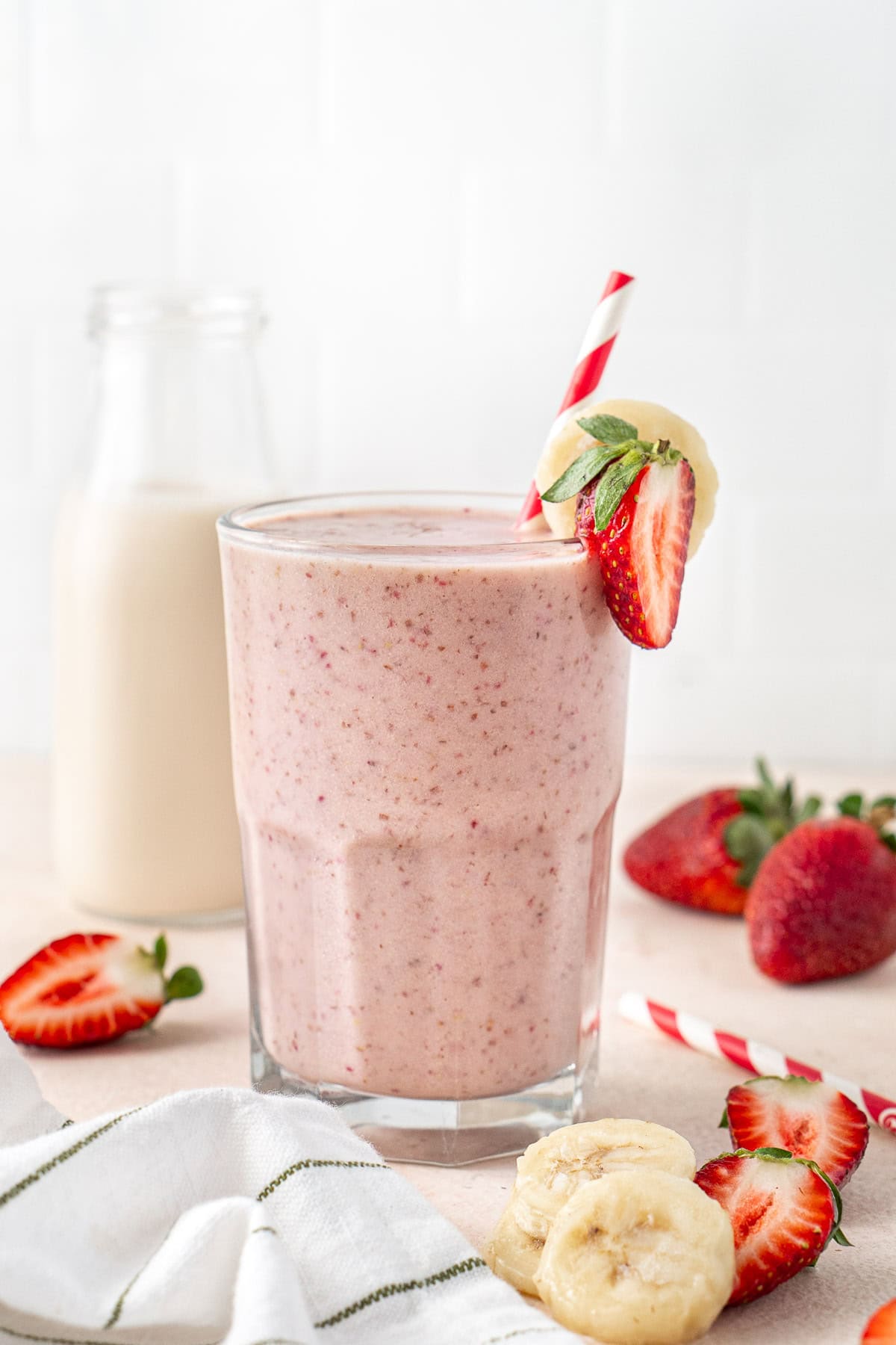 A dairy free strawberry banana protein smoothie in a glass.