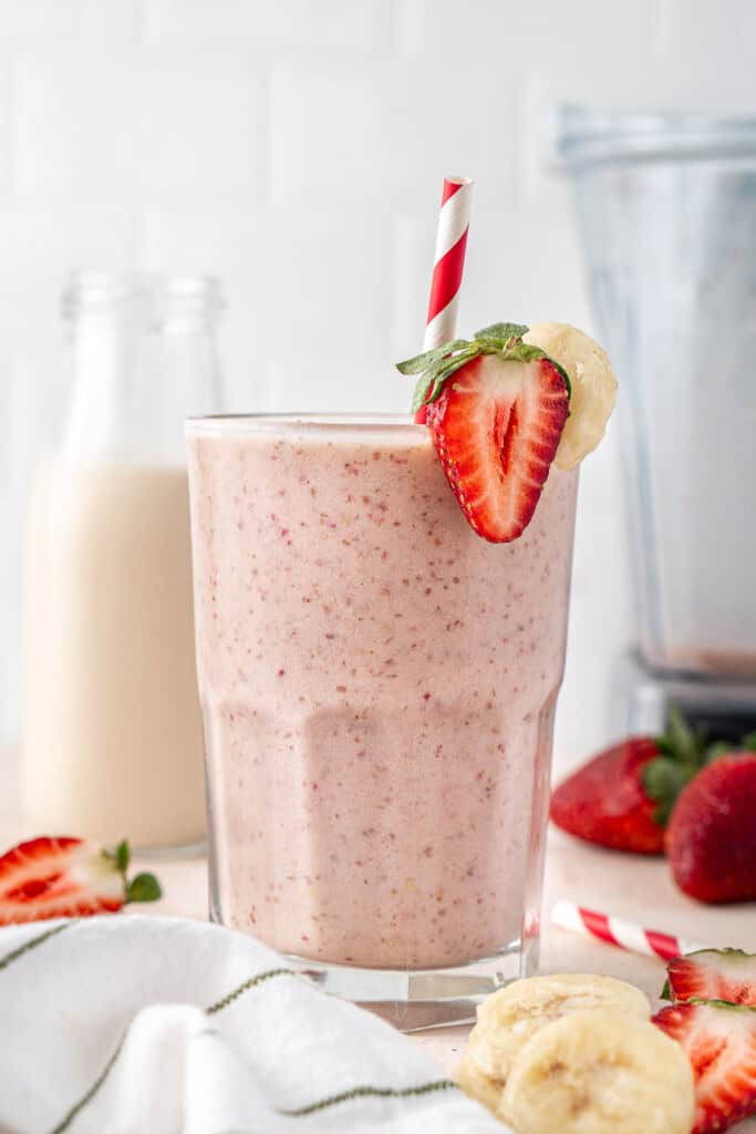 The strawberry banana protein smoothie in a glass.