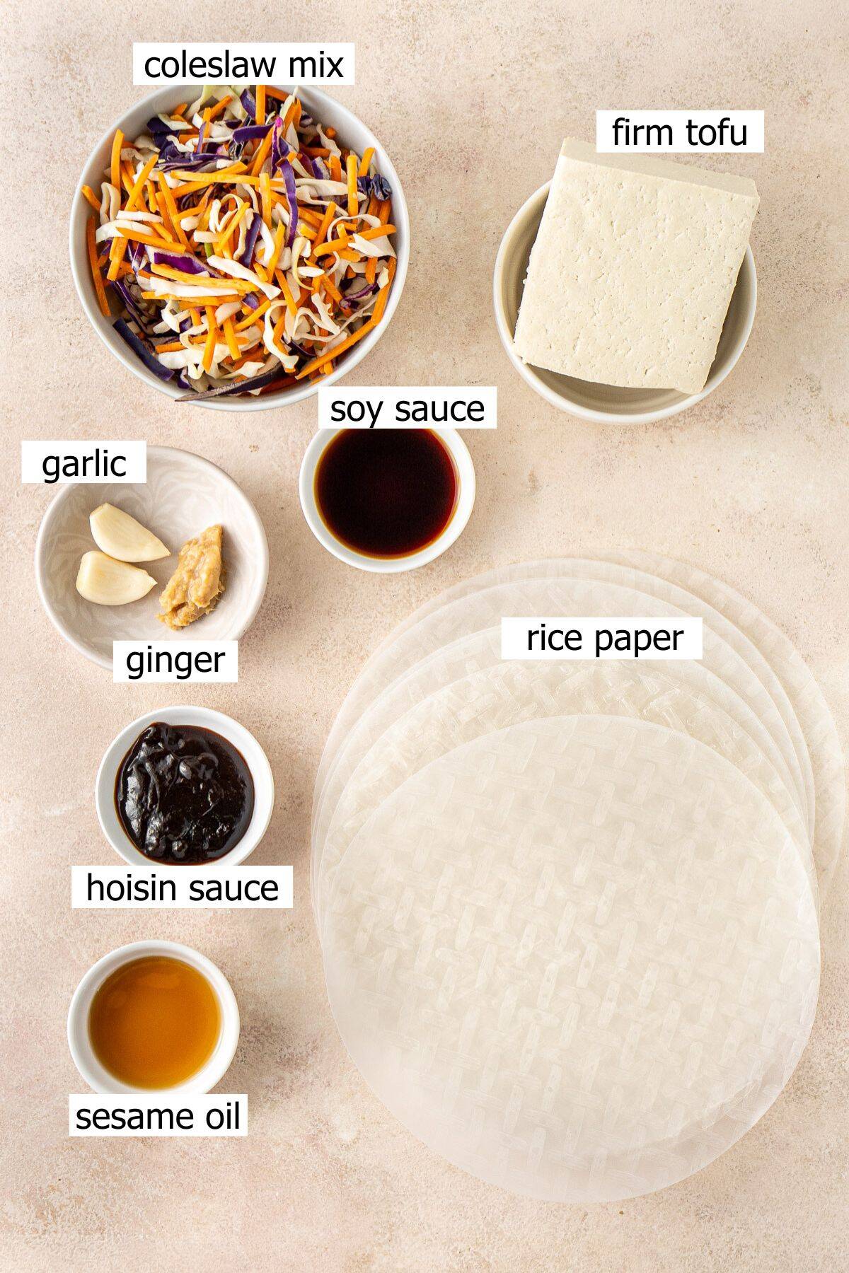 All ingredients needed to make crispy rice paper dumplings laid out in bowls.