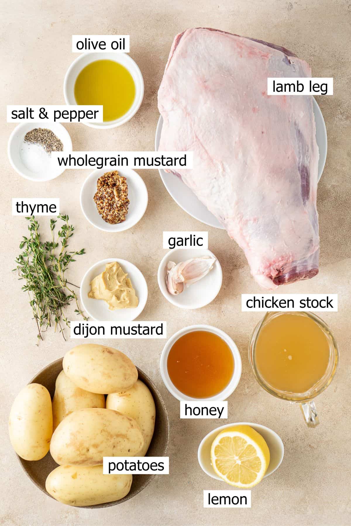 All ingredients needed to make glazed lamb laid out in bowls.