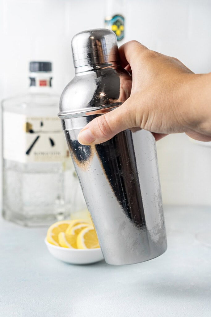 Shaking the cocktail in a shaker.