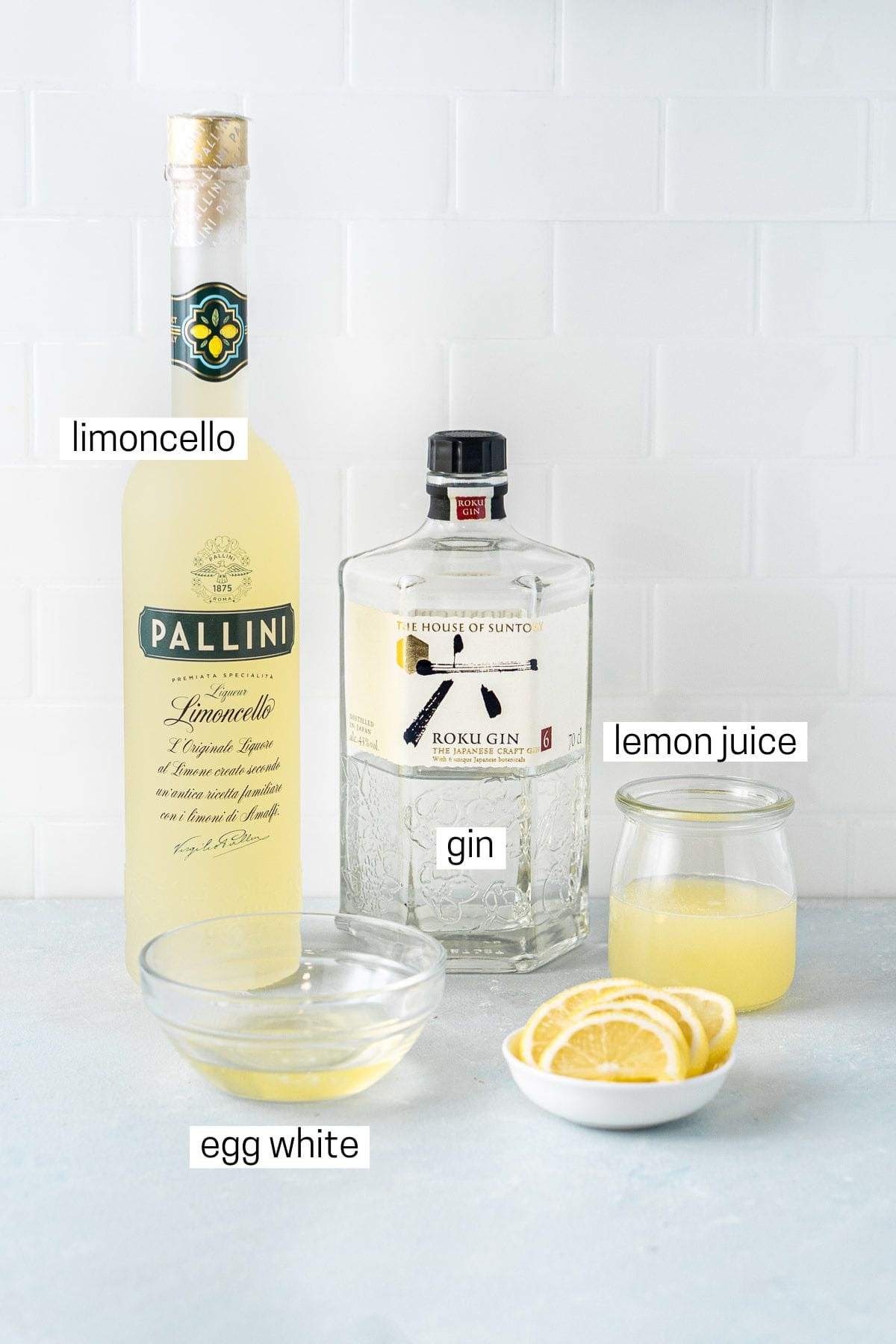All ingredients needed to make a limoncello sour.