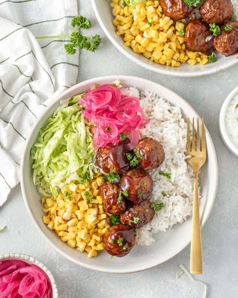 Red pickled onions served with bbq chicken meatballs.