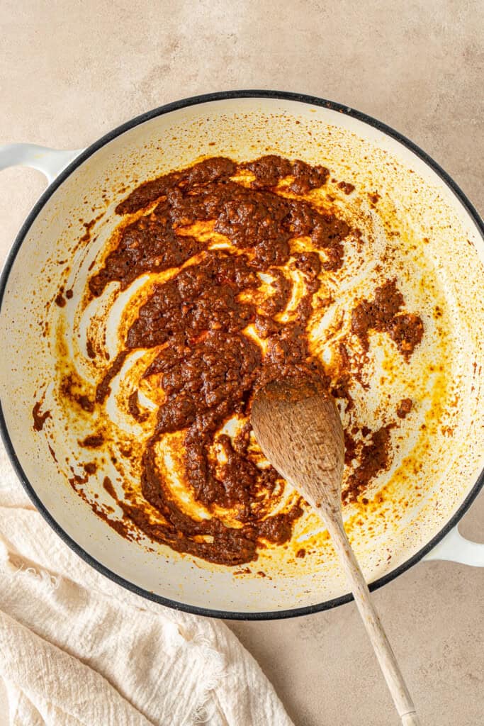 Cooking the aromatics in a pan.