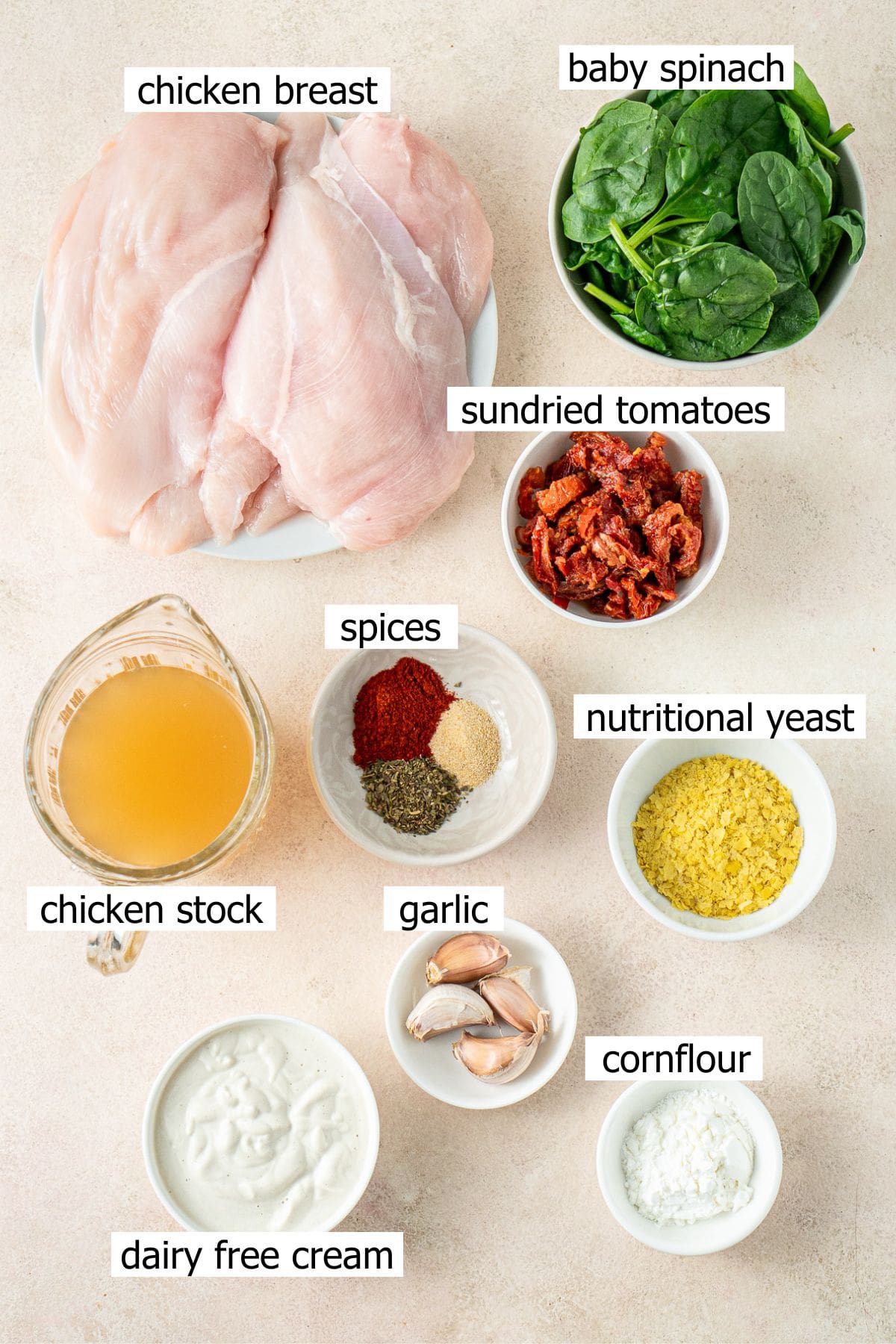 All ingredients needed to make slow cooker marry me chicken laid out in small bowls.