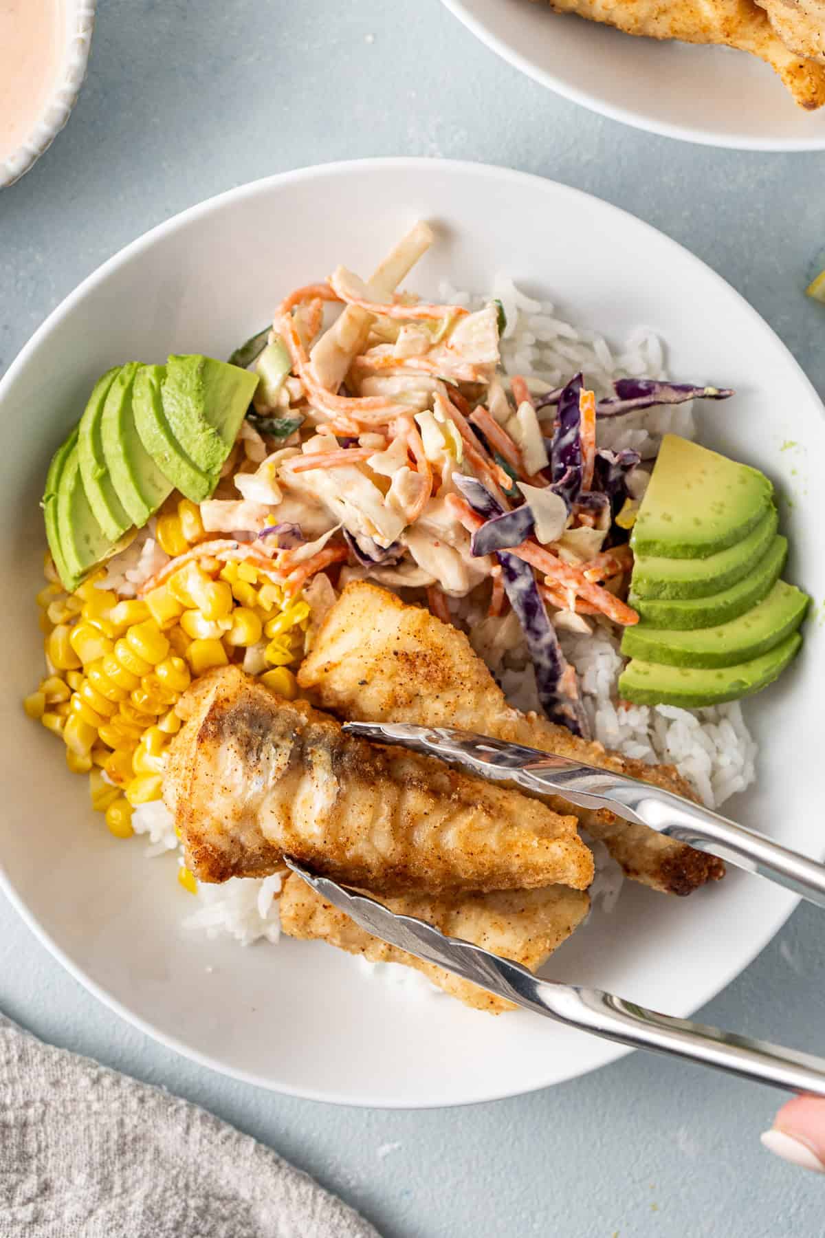 Assembling the rice bowls.