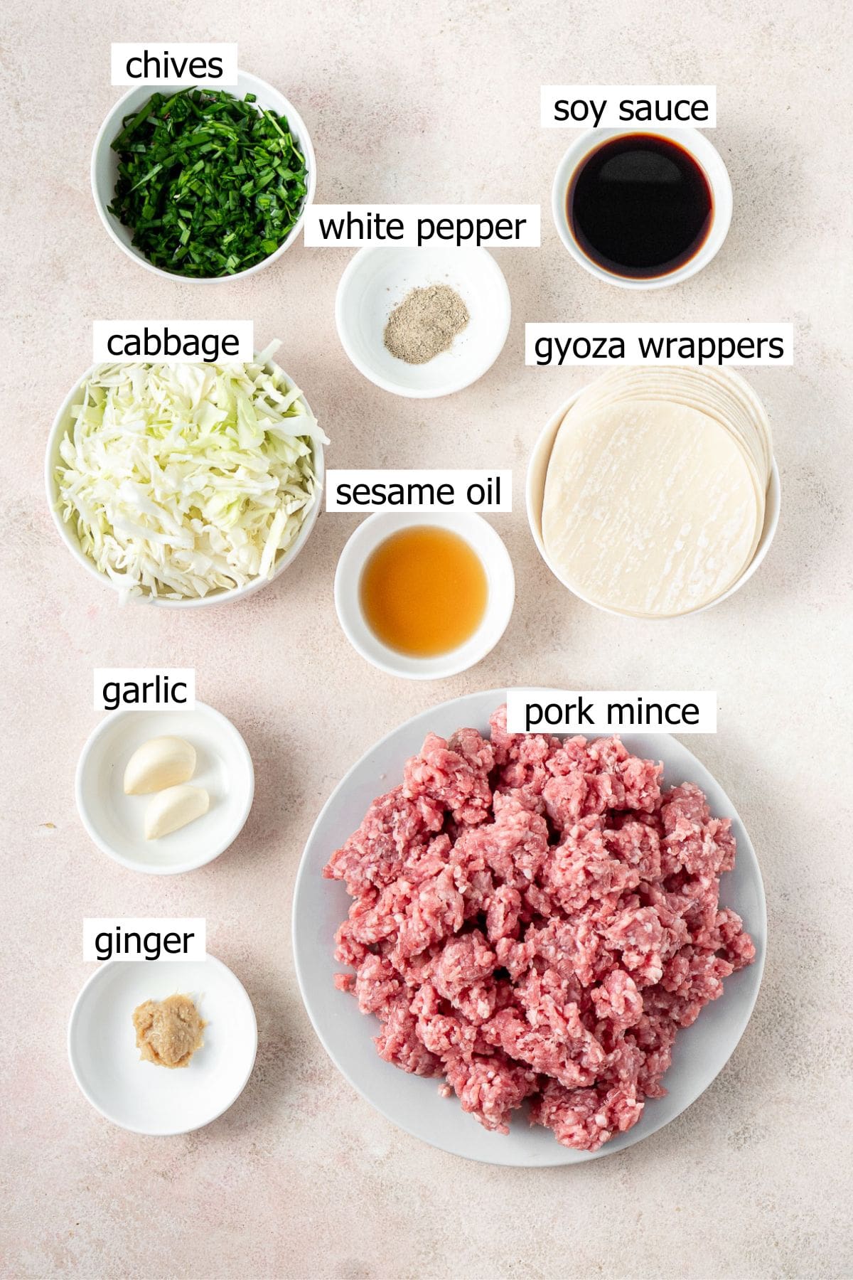 All ingredients needed to make no fold dumplings laid out in bowls.