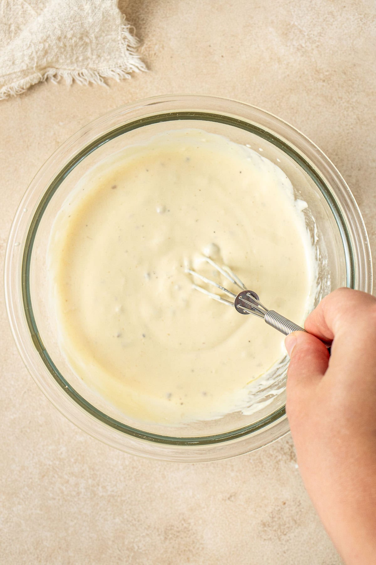The dairy free caesar salad mixed in a bowl.