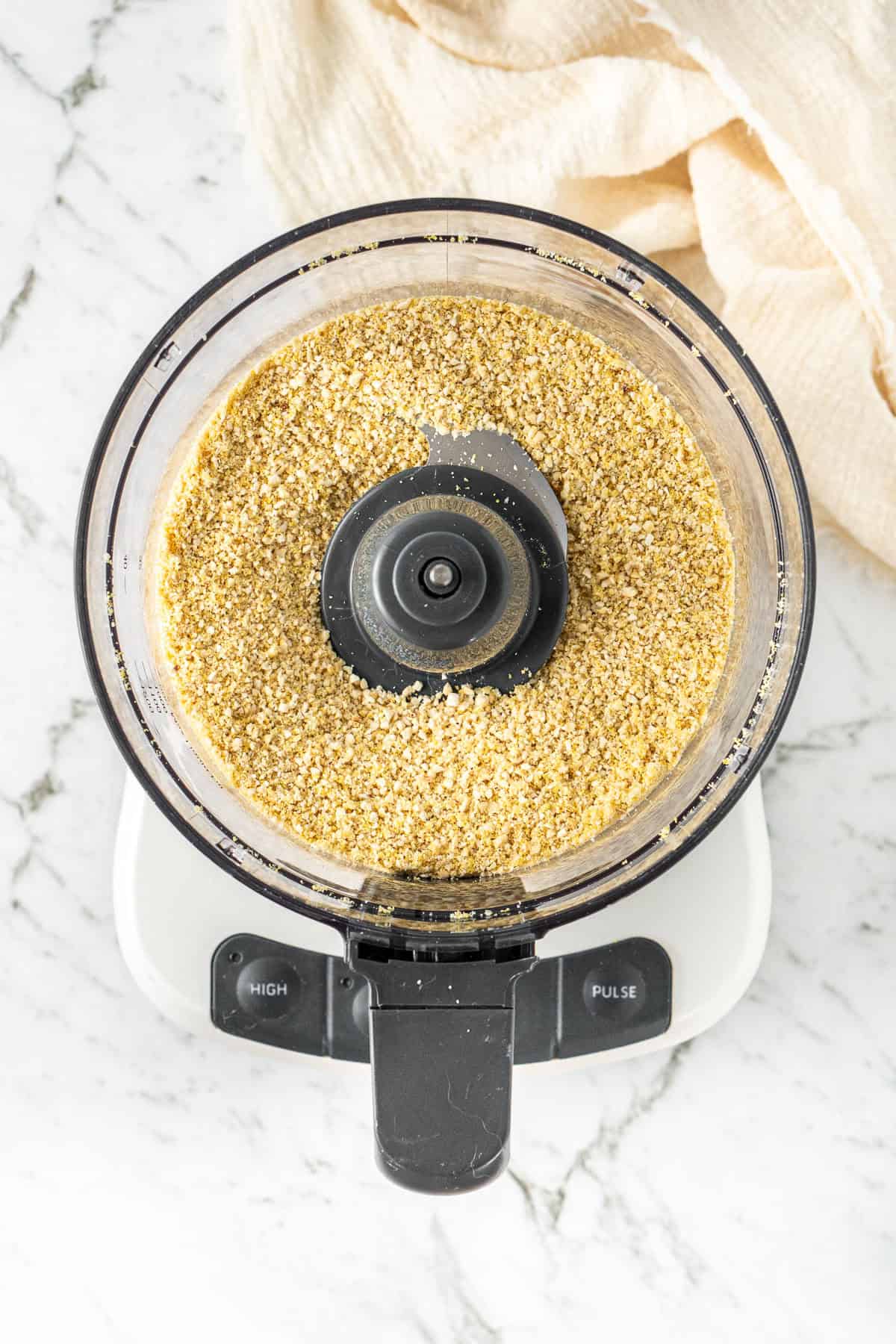 The vegan parmesan blended in a food processor.