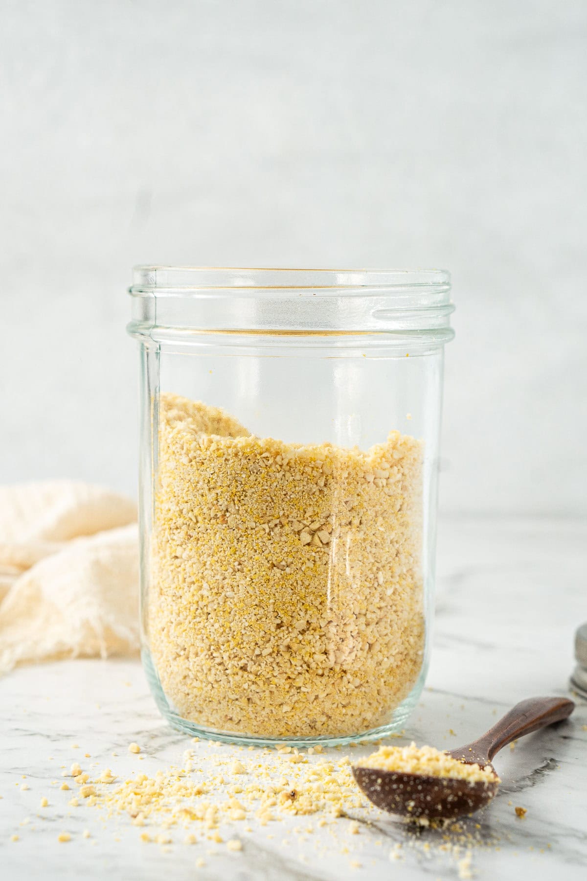 A jar of vegan parmesan cheese.