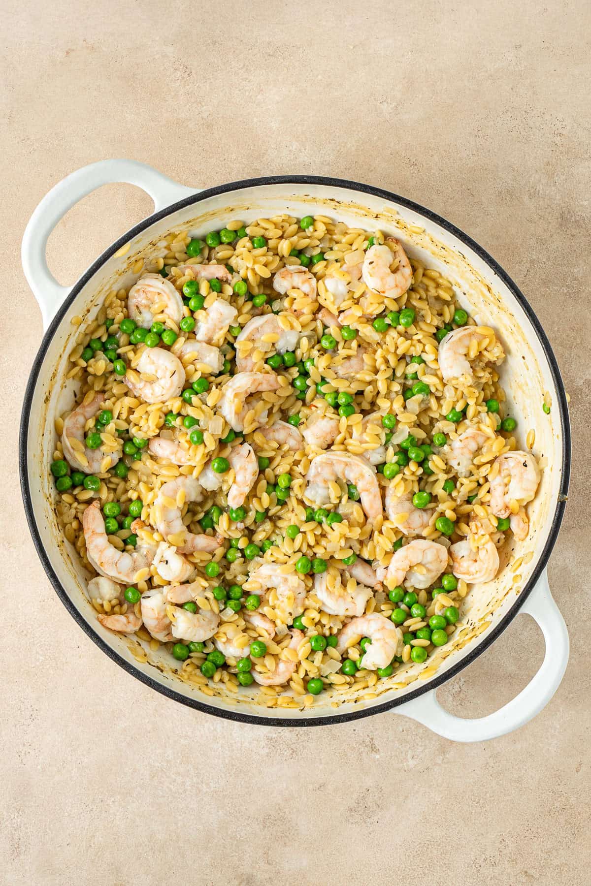 The cooked prawns and peas mixed through the orzo.