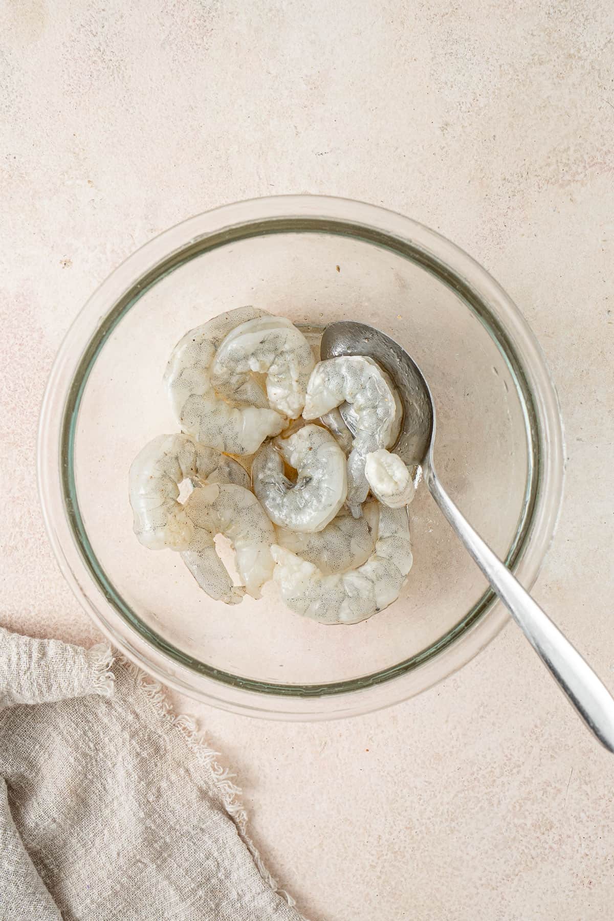 Mixing the prawns in a bowl.