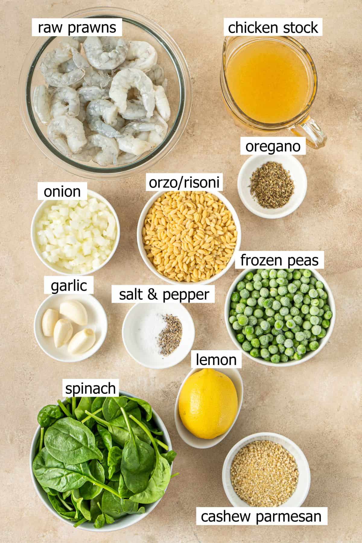 All ingredients needed to make lemon shrimp orzo laid out in small bowls.