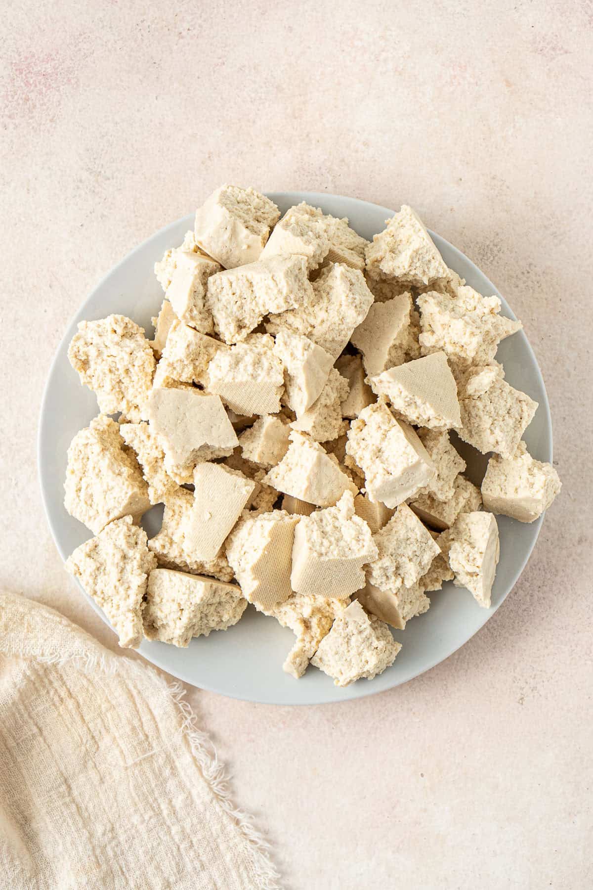 The tofu torn into bite-sized pieces.