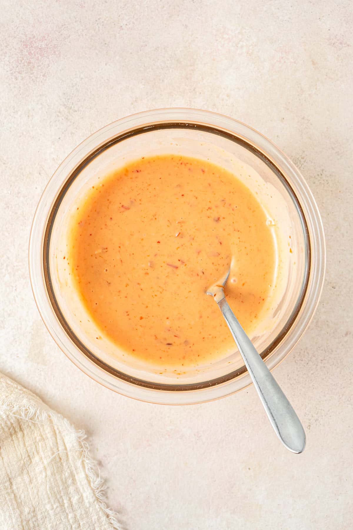 The bang bang sauce mixed in a small glass bowl.