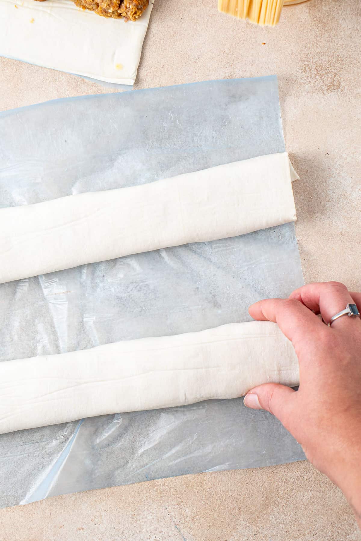 Rolling up the sausage rolls.