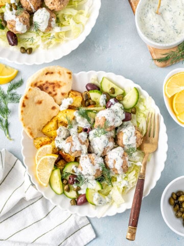 Greek meatball bowls with dairy free tzatziki, lemon and pita bread.