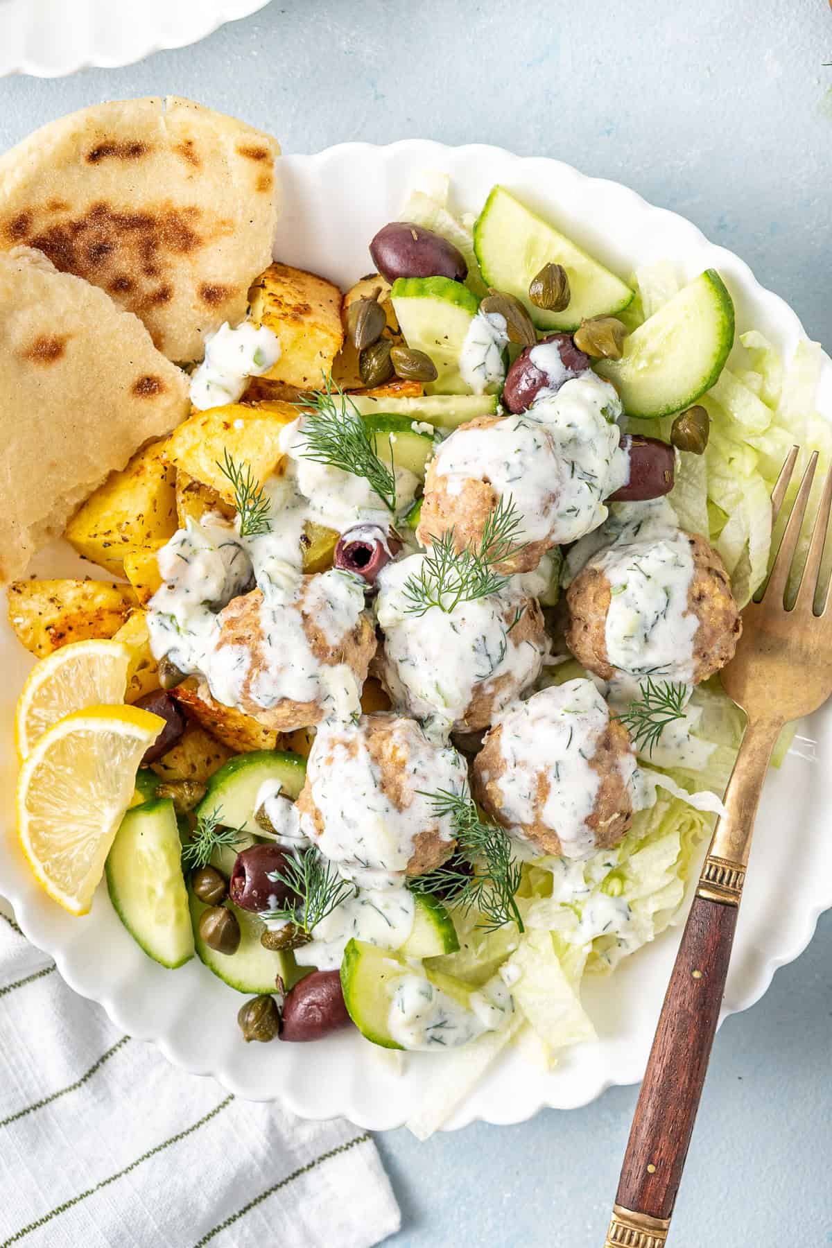 Close up of the greek meatball bowls with dairy free tzatziki. 