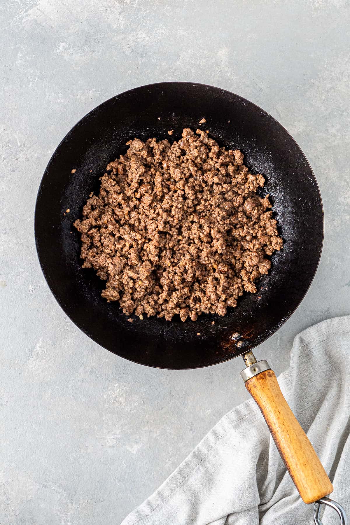 The mince cooked in a wok with the sauce.