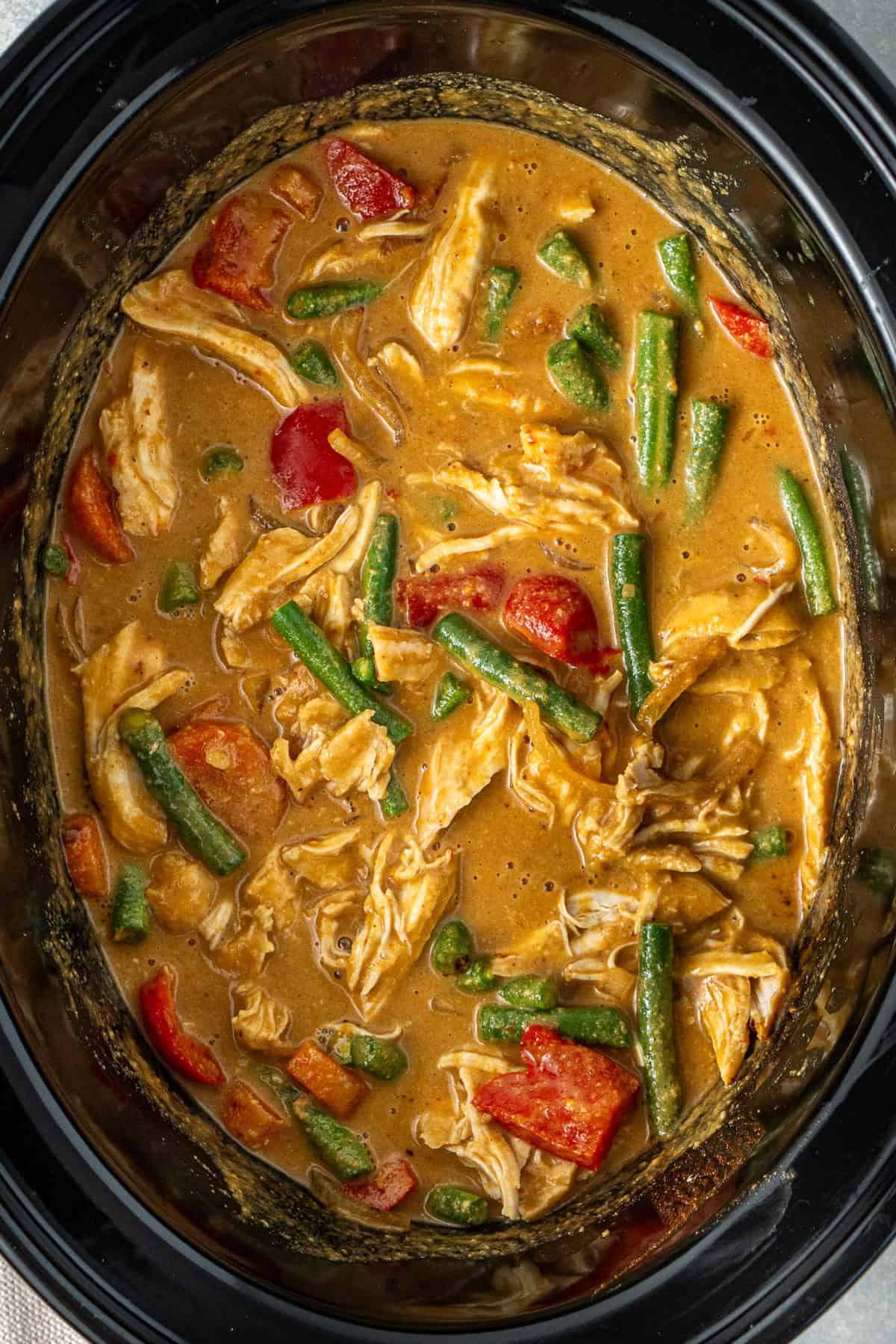 The finished slow cooker satay chicken in the slow cooker.