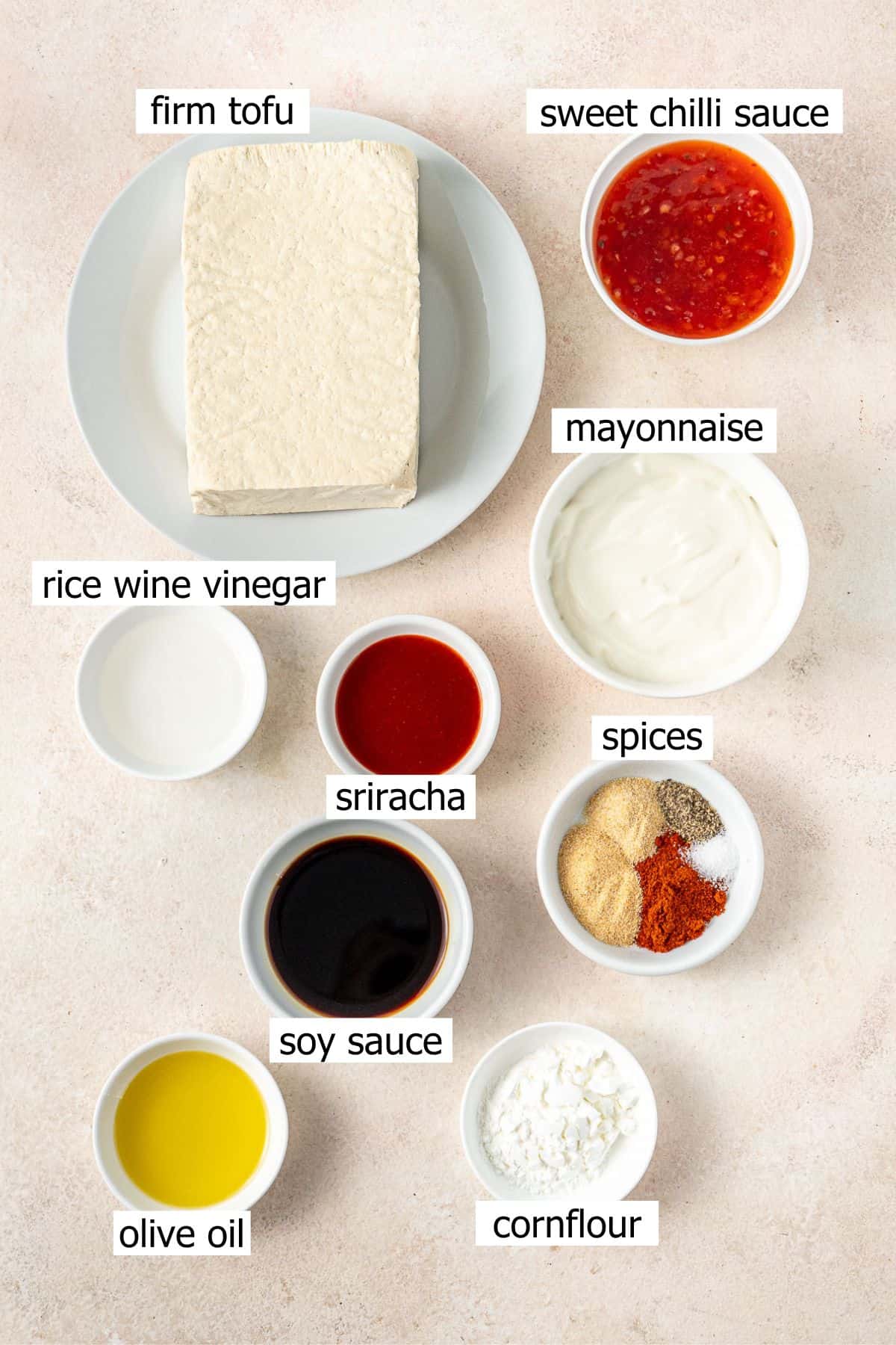 All ingredients needed to make bang bang tofu laid out in small bowls.