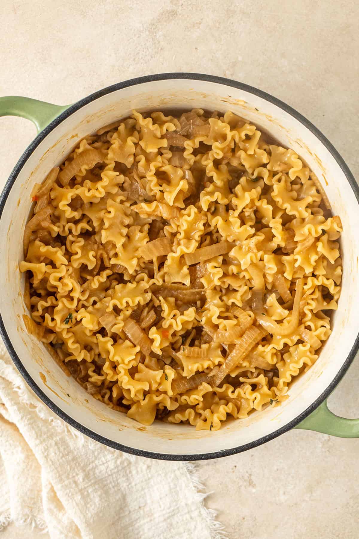 The cooked french onion pasta in the pot.