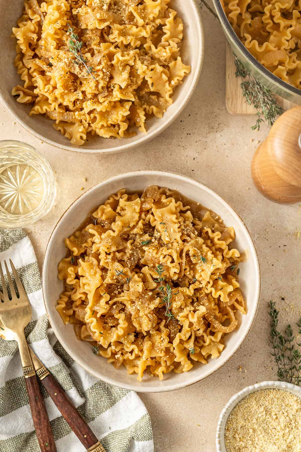 The served french onion pasta in bowls.