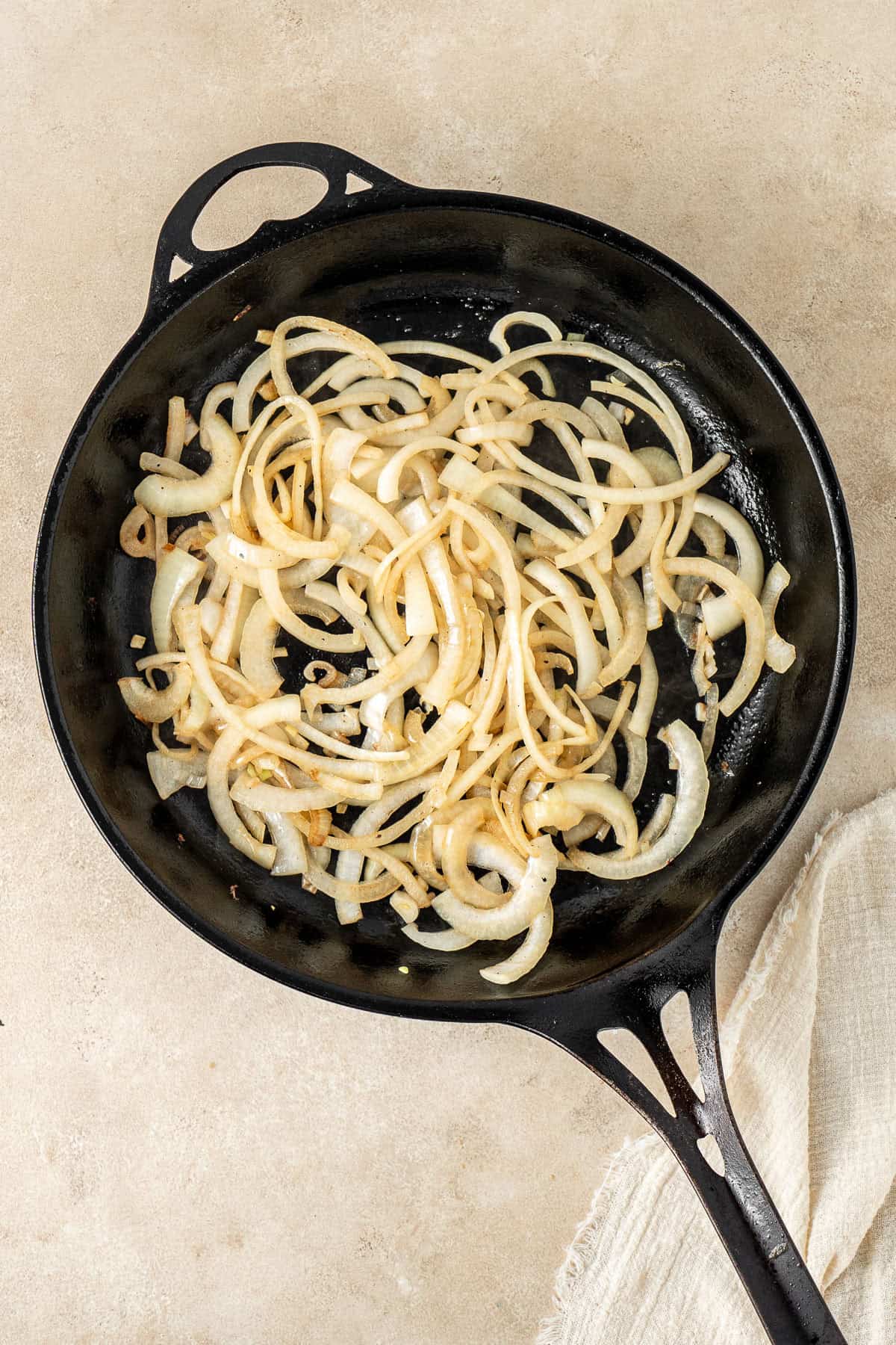 Browning the onions in a cast iron pan.