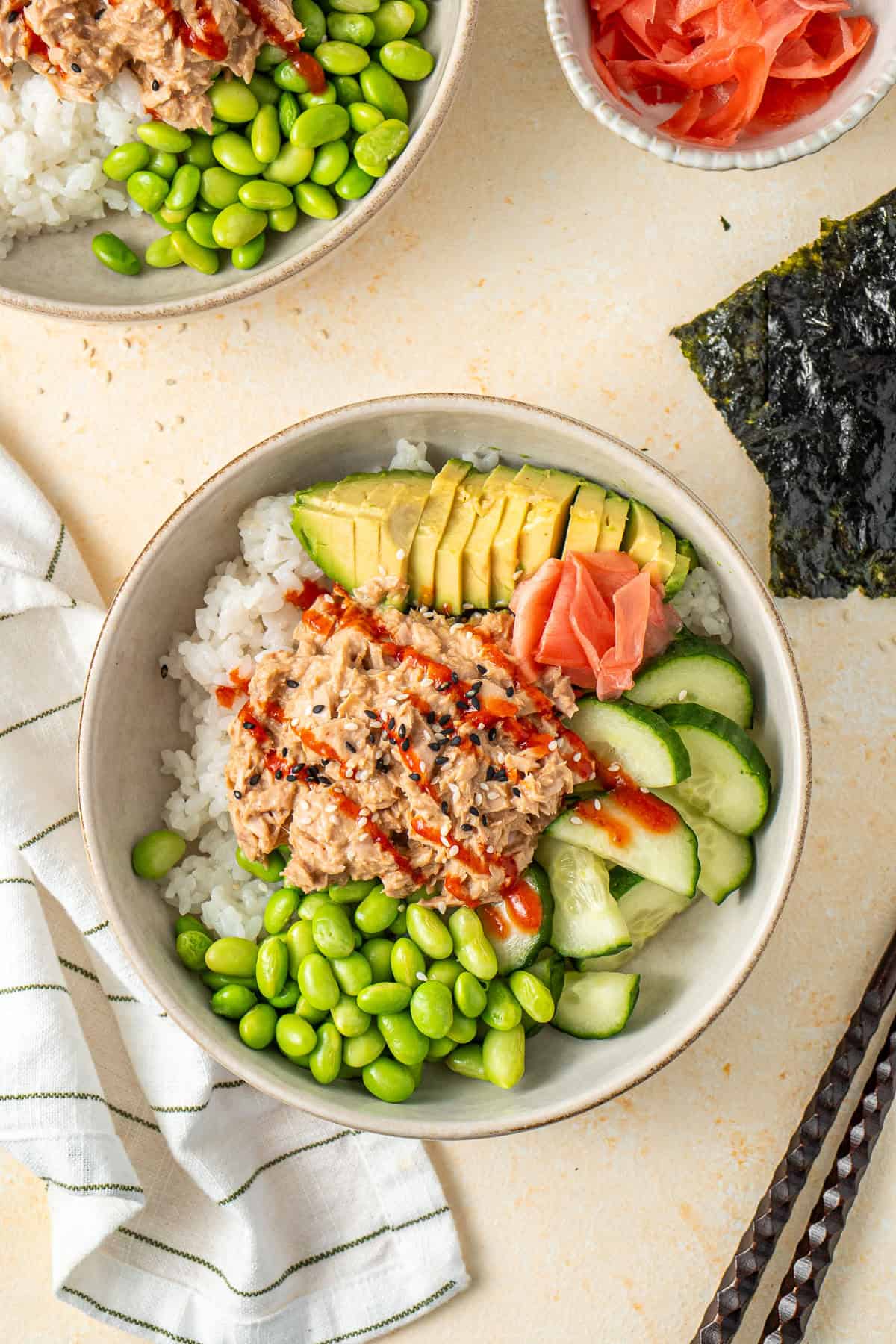 The finished spicy tuna bowls with avocado, cucumber and edamame.
