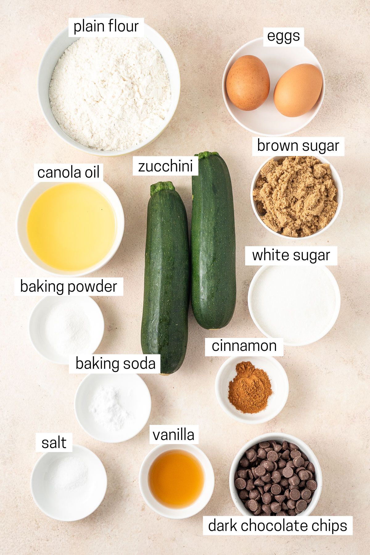 All ingredients needed to make dairy free zucchini bread laid out in bowls.