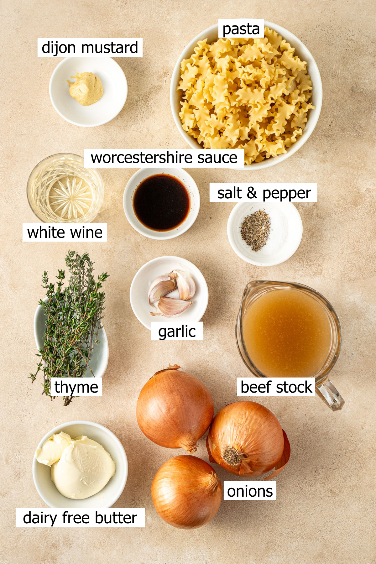 All ingredients needed to make french onion pasta laid out in small bowls.