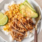 Close up of an assembled dairy free street corn chicken rice bowl.